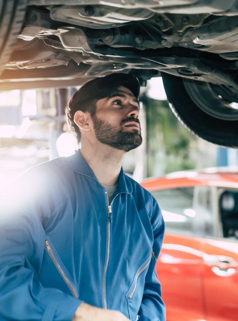 Mechanic inspecting a vehicle - MOT Testing Wellingborough